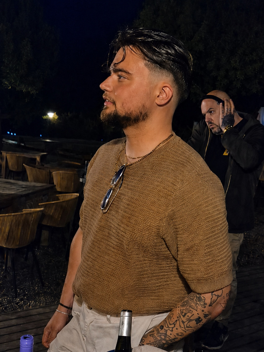 Evening portrait of Mitch Mottram on an outdoor terrace after an event