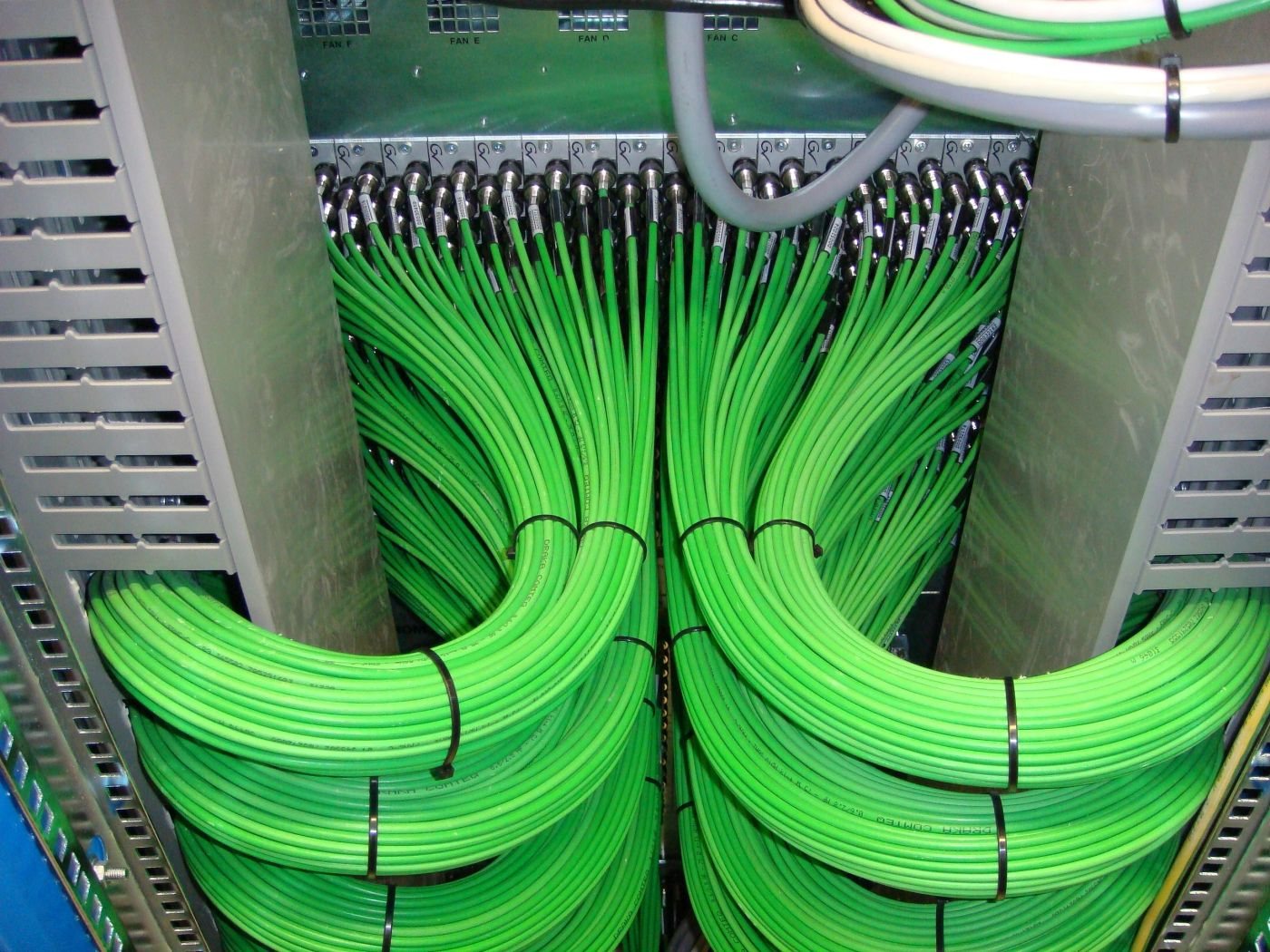 Fibre termination into rack Hundreds of green fibre cables terminated into a broadcast rack by the Mottram Broadcast team led by Mitch Mottram